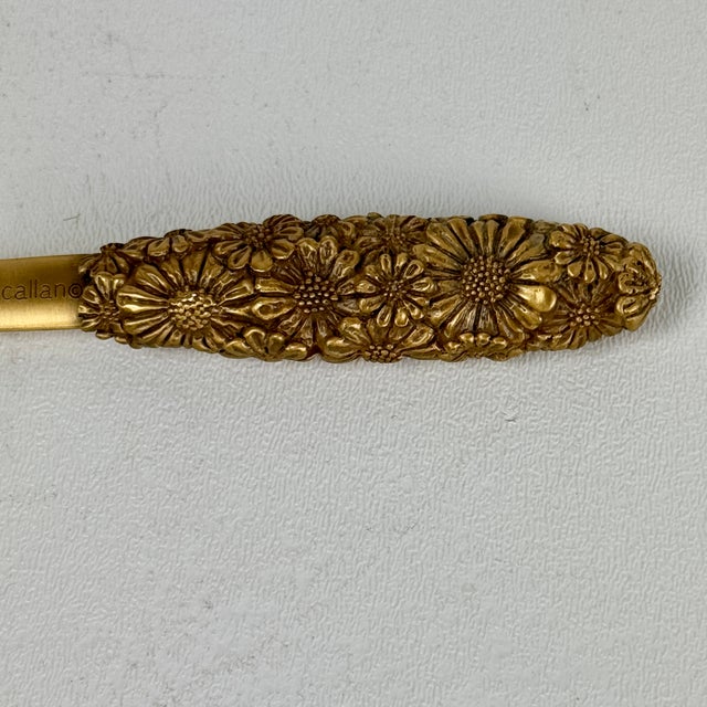 A rare vintage piece from jewelry designer Karen Callan; a handcrafted brass letter opener with flowers design. It is...