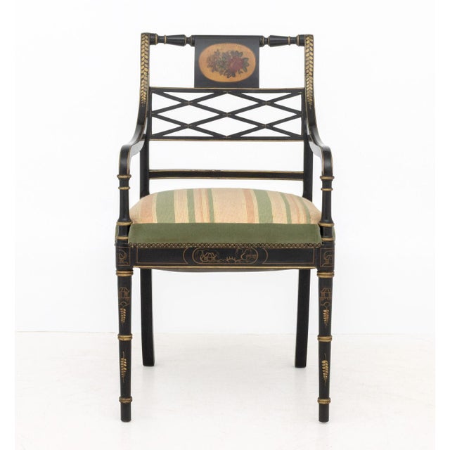 Regency Style Gilt and Ebonized Side Chair, floral design painted to backrest, gilt detailing, faux bamboo legs, and...