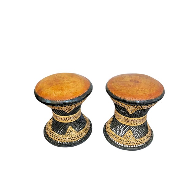 Pair of mid century woven rattan and leather Anglo Indian or possibly Moroccan stools. Beautiful woven black and tan bases...