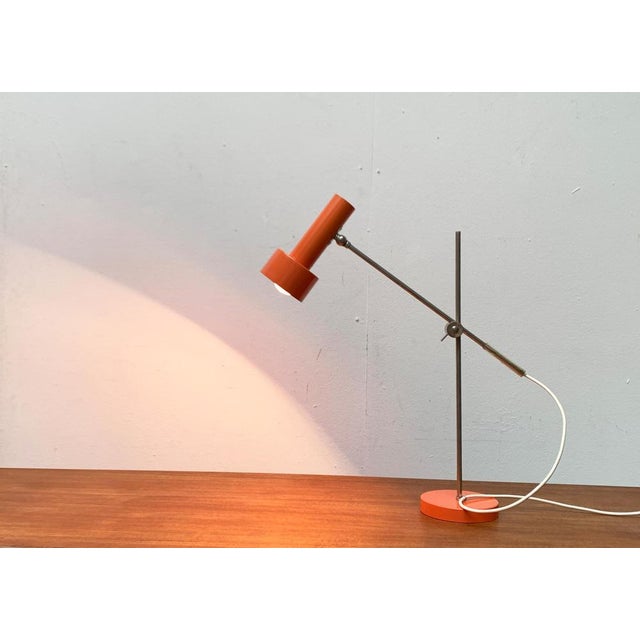 Minimalist Mid Century table lamp from Beisl in a special color. The minimalist radiator shape of the light head is...