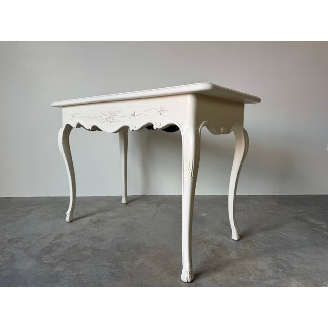 A charming and elegant vintage French Provincial console/secretary desk by the renowned Auffray & Co., known for their...