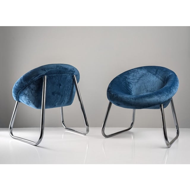 Pair of Italian design armchairs from the 70s that captures the elegance and essence of the time with an impeccable...