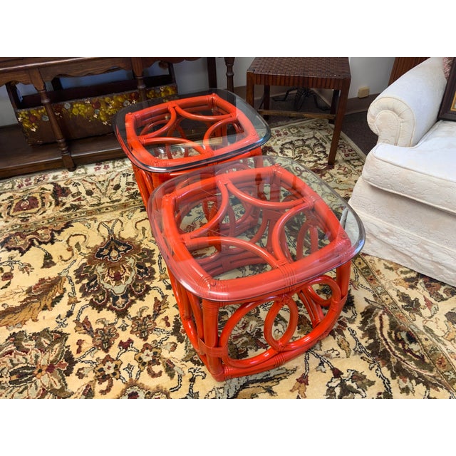 Mid 20th century rattan side tables with glass tops. Rattan has been painted over original finish.
