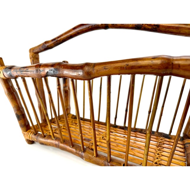 Bring iconic vintage to your space with our stunning 1960's Mid Century Burnt Tortoise Bamboo Magazine Rack, a testament...