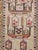 An antique Turkish Ghiordes carpet from the first quarter of the 20th century in shades of light blue, purple, red, and...
