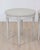 Made in Sweden in the twentieth century, this pair of round tables features carvings and decorative detail. The round tops...