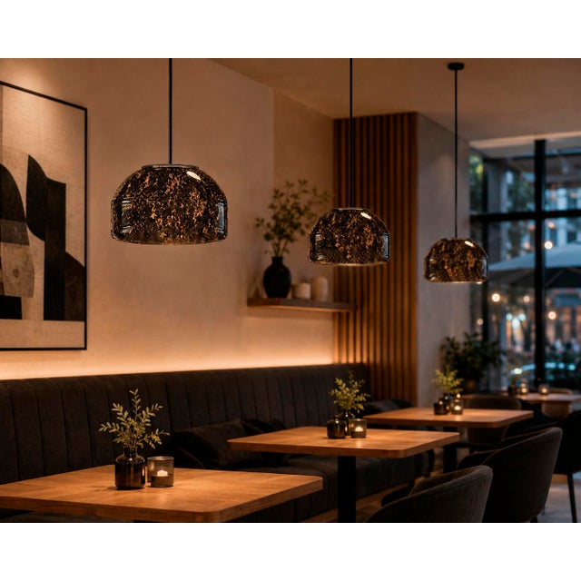 Crafted with high visual clarity, this modern pendant lamp features a sleek silhouette hand-blown from premium glass in a...