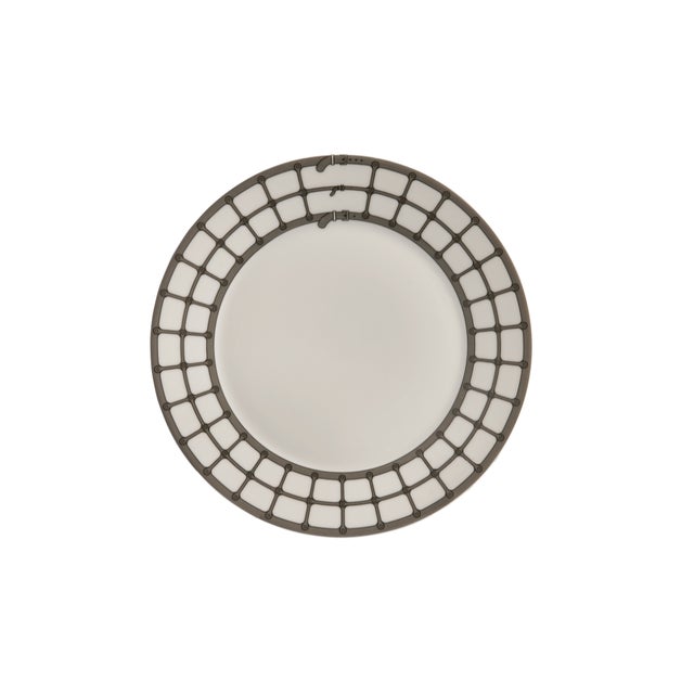 Crafted from fine porcelain, this set of four Aryan Bread & Butter Plates draws inspiration from the tailored detailing of...