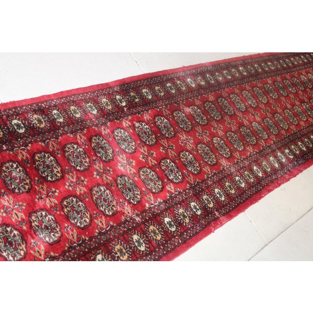 Red Vintage Hand-Knotted Wool Bokhara Runner Rug. 21'x 2'7