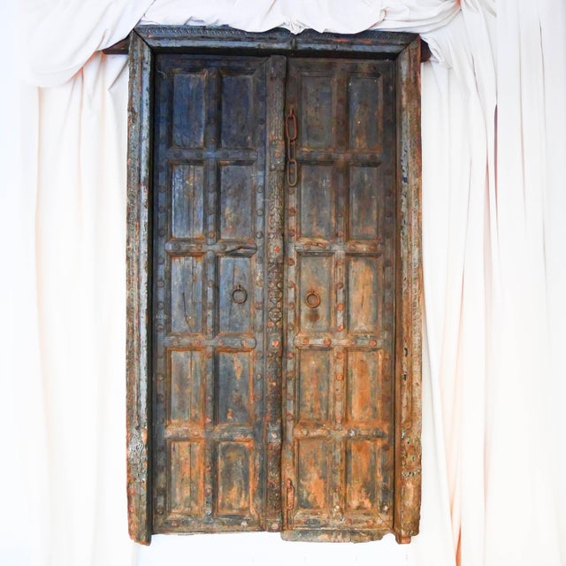 This pair of antique solid teak doors, dating from the early 19th century (circa 1800-1850), comes from the demolition and...