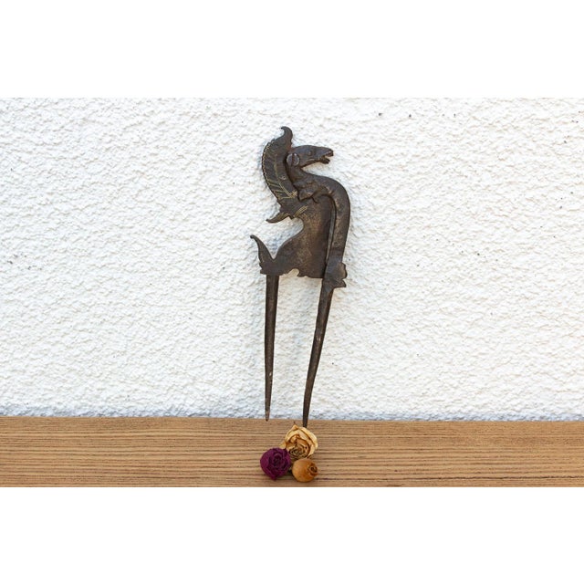 An exceptional Early 19th-century North Indian hand-cast bronze and iron betel nut cutter (Sarota), featuring a...
