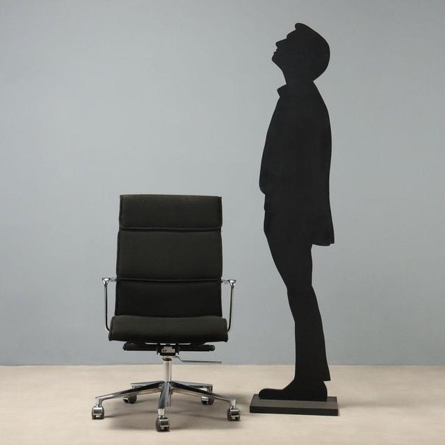1970s office chair designed by Charles & Ray Eames for ICF, featuring an aluminum frame that seamlessly integrates with...