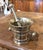 This handsome antique mortar and pestle combines substantial weight, sculptural form, and the practical character of...