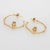 Distinct and stylish pair of diamond owl hoop earrings crafted in 14k yellow gold. Four round brilliant cut diamonds total...