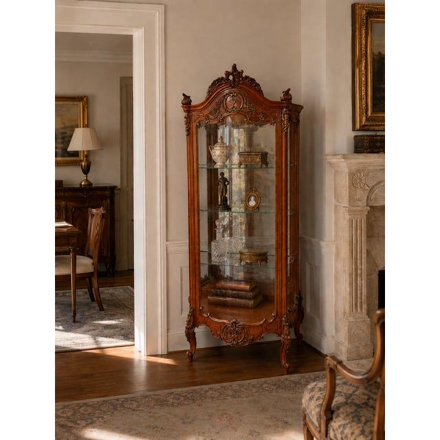 Elegant vintage curio cabinet by Milano Furniture Company of Chicago, featuring an ornate French Louis XV–inspired design...