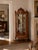 Elegant vintage curio cabinet by Milano Furniture Company of Chicago, featuring an ornate French Louis XV–inspired design...