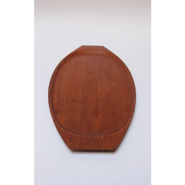 Gondola-form teakwood tray manufactured in the 1960s by Tapio Wirkkala for Kalmar of Sweden. Elegant, graceful form with...