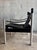 A refined expression of Swedish modern design, this safari lounge chair by Börje Johanson pairs architectural restraint...