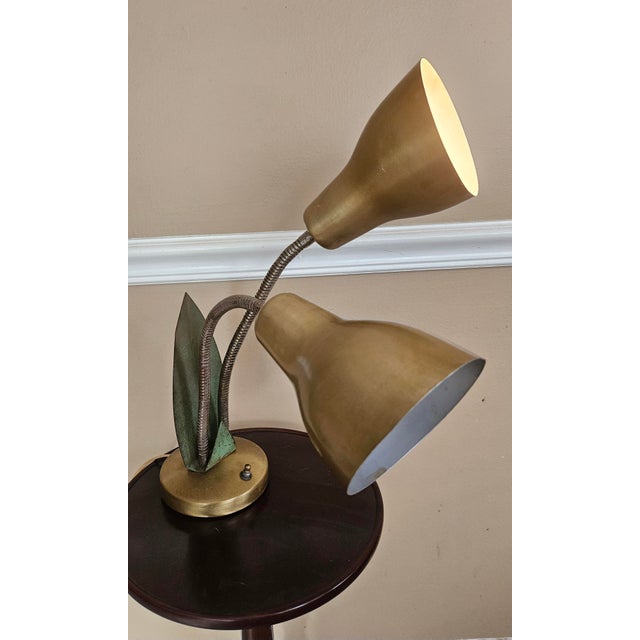 1950s double gooseneck gold desk lamp. Both lights work independently or together. The lamp can also be wall hung like a...