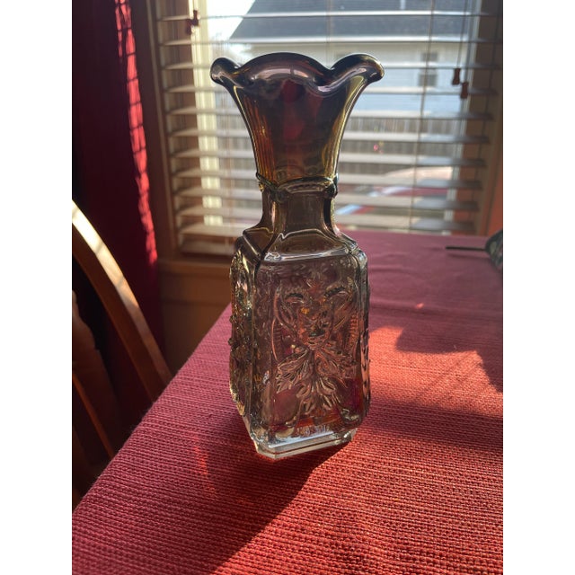 Iridescent Mephistopheles Devil carnival glass vase, made by the Imperial Glass Company. Has a Jester or Demon on two...