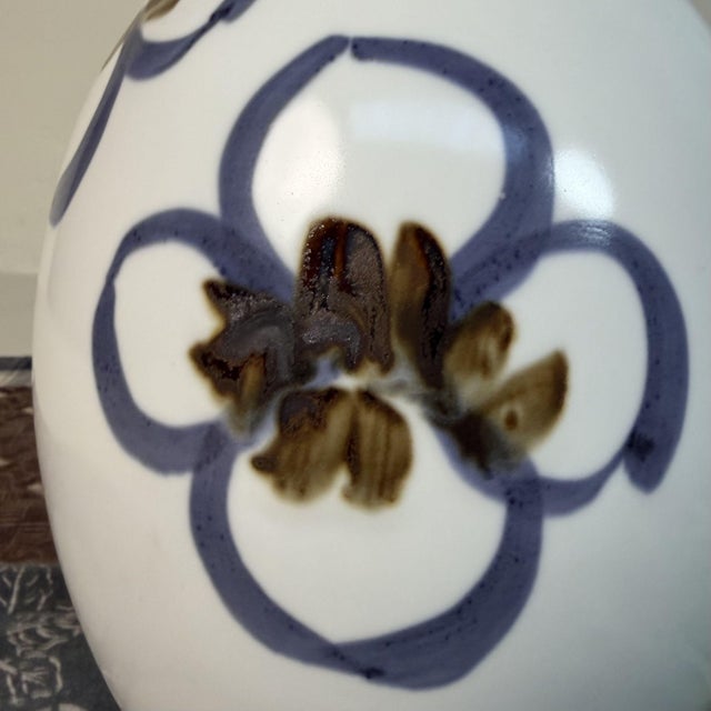 This refined ikebana vase is made of bright white porcelain and features a softly rounded body with a gently flaring neck....