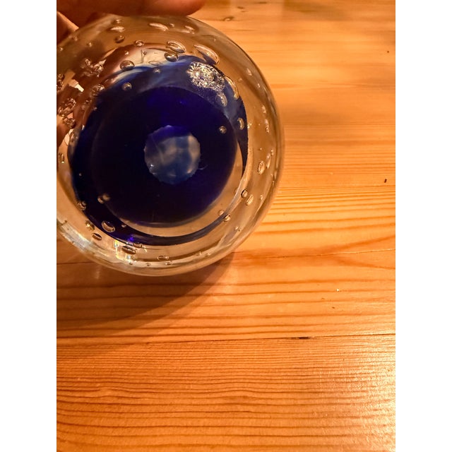 Elevate your mantle, desktop, or shelving display with this striking, matching pair of vintage hand-blown art glass sphere...