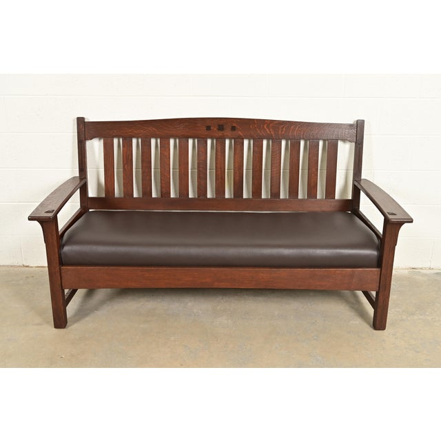 An exceptional antique Mission or Arts & Crafts period "Ebon-Oak" settle, sofa, or bench By Charles P. Limbert Co. USA,...