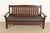 An exceptional antique Mission or Arts & Crafts period "Ebon-Oak" settle, sofa, or bench By Charles P. Limbert Co. USA,...
