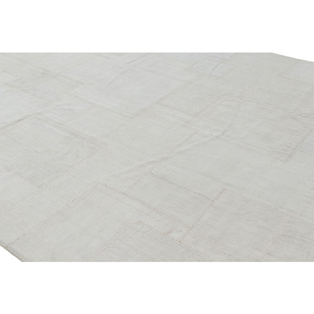 Handwoven in a wool flat weave, this 10x13 patchwork Kilim rug from Rug & Kilim uses Kendir, a kind of all-natural "bast"...