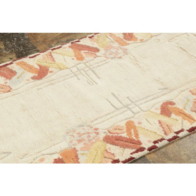 Hand-knotted in wool, this contemporary 3x12 runner reimagines French Deco style with a minimalist ivory field framed by...
