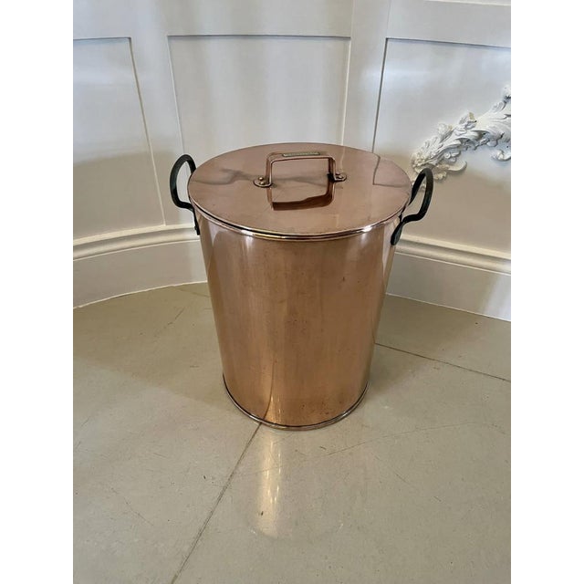 Large circular quality antique copper lidded pot with two original iron carrying handles, copper lift off lid with...
