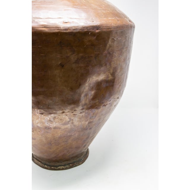 Offering the gorgeously aged copper wine vessel. Mid-19th century hammered copper, with dovetailing. Made to store wine...