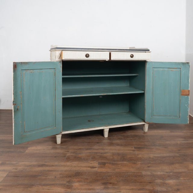 Gustavian pine sideboard or buffet with traditional decorative fluted diamond panels on cabinet doors raised on tapered...