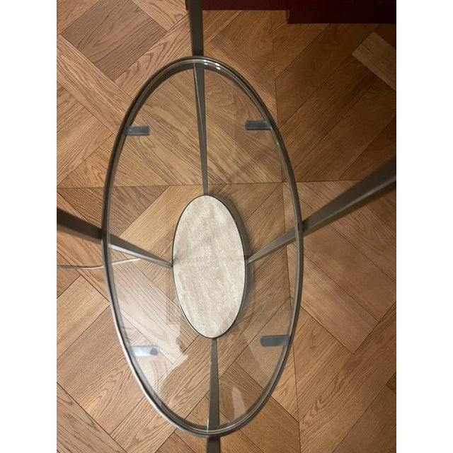 A refined pair of architectural floor lamps in deep patinated bronze, featuring a slender open-frame structure with...