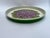 A single vintage round metal serving tray featuring a green back and painted purple hydrangea decoration.