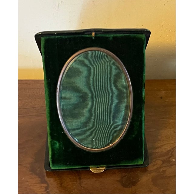 Mark Cross leather picture frame for a photo with emerald green velvet and moire silk lining from Vienna, Austria. Folds...