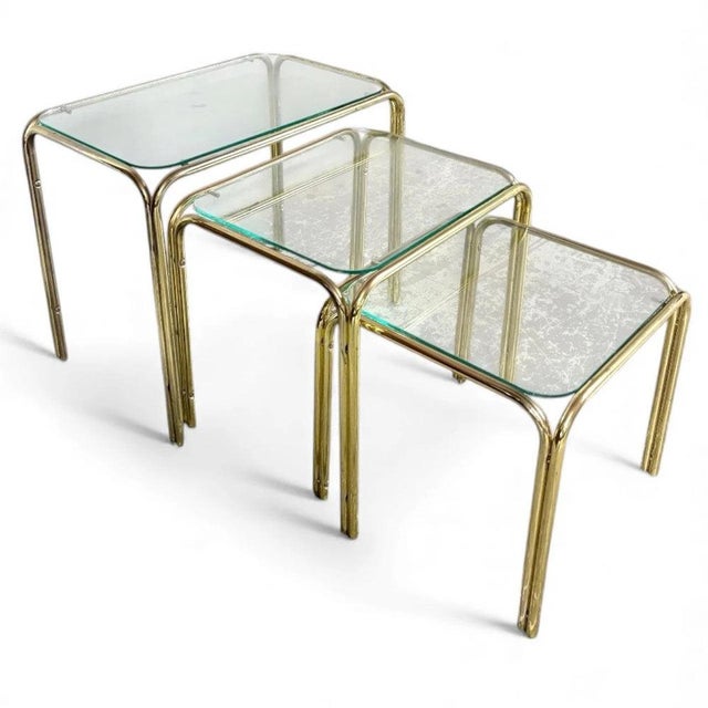 This set of vintage nesting tables offers a perfect blend of style and function, featuring vintage nesting tables crafted...
