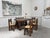 Solid oak dining table attributed to Charles Dudouyt, a renowned French cabinetmaker and designer of the 1920s and 1930s....