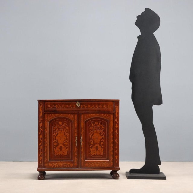 Dutch mahogany sideboard with maple trim and inlays. Tripartite top with medallion and ribbon inlay in the center, and...