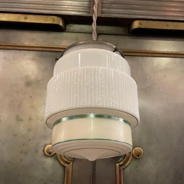 Art Deco pendant light with a layer cake, green stripe, milk glass shade and gunmetal hardware is newly wired with 48...