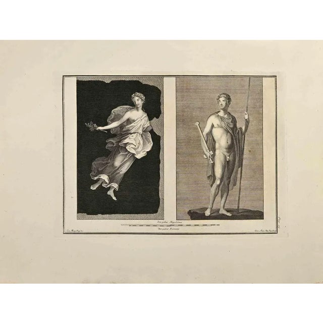 Deities from "Antiquities of Herculaneum"is an etching on paper realized by Giuseppe Aloja in the 18th Century. Signed on...