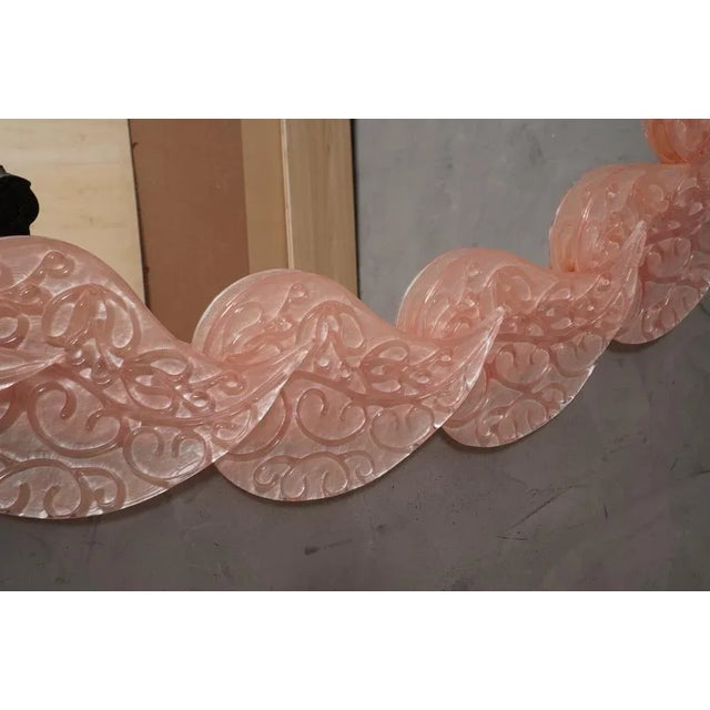 Gorgeous flaming pink Murano glass mirror. A mirror that alone will furnish your home. The mirror has a wooden back...
