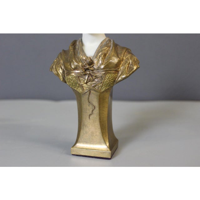 Bust of a young woman in gilt bronze and white Carrara marble, signed L. Vordormayer for Ludwig Vordormayer 1863/1933, the...