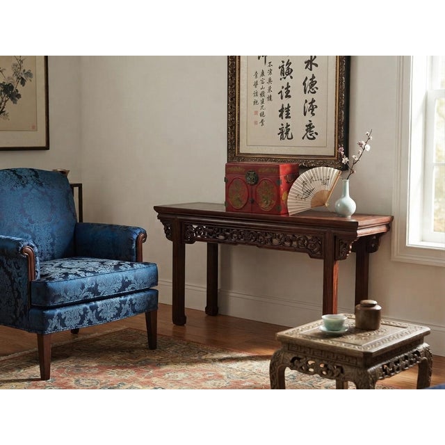 This ornate, Asian-inspired jewelry box features a rich red veneer finish embellished with intricate gold and black...