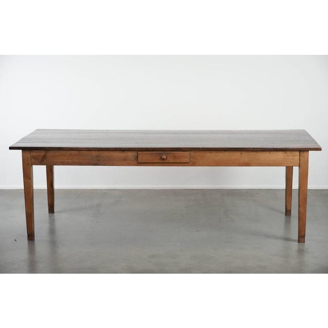 Offered ByThijs this beautiful authentic large French farmer antique XXL dining table with two drawers and a beautiful...