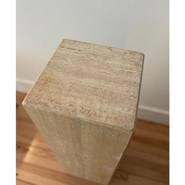 Groovy travertine pedestal to display your fleurs or favorite sculpture.