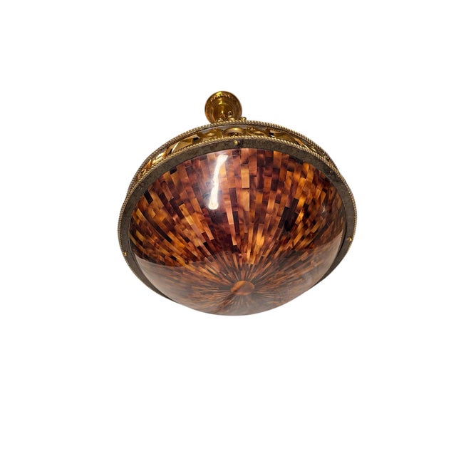 Very rare piece from Maitland Smith. A mixture of antiqued brass, darkly painted metal and a pin shell bowl. This is truly...