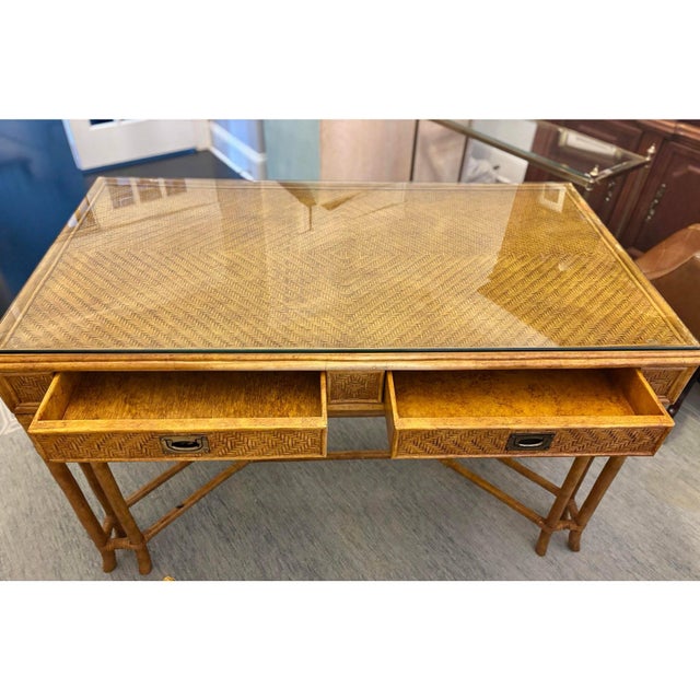 Offered is rattan and bamboo writing desk and coordinating chair by Lexington furniture. This set includes a protective...