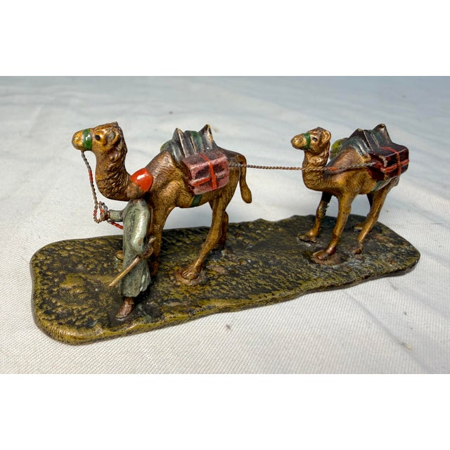 Up for sale is an exquisite antique 19th century Austrian Vienna bronze of a two camel caravan lead by a man, a...