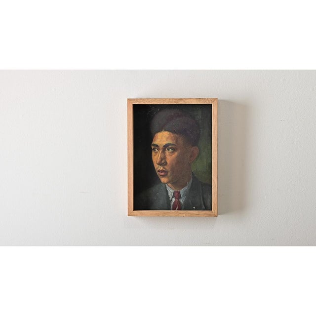 This emotive French vintage oil painting captures the portrait subject's striking features and dapper clothes set off by a...
